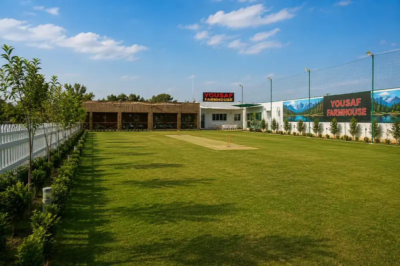 The private cricket ground at Yousaf Farmhouse, Faisalabad, with the pitch, netting and floodlights
